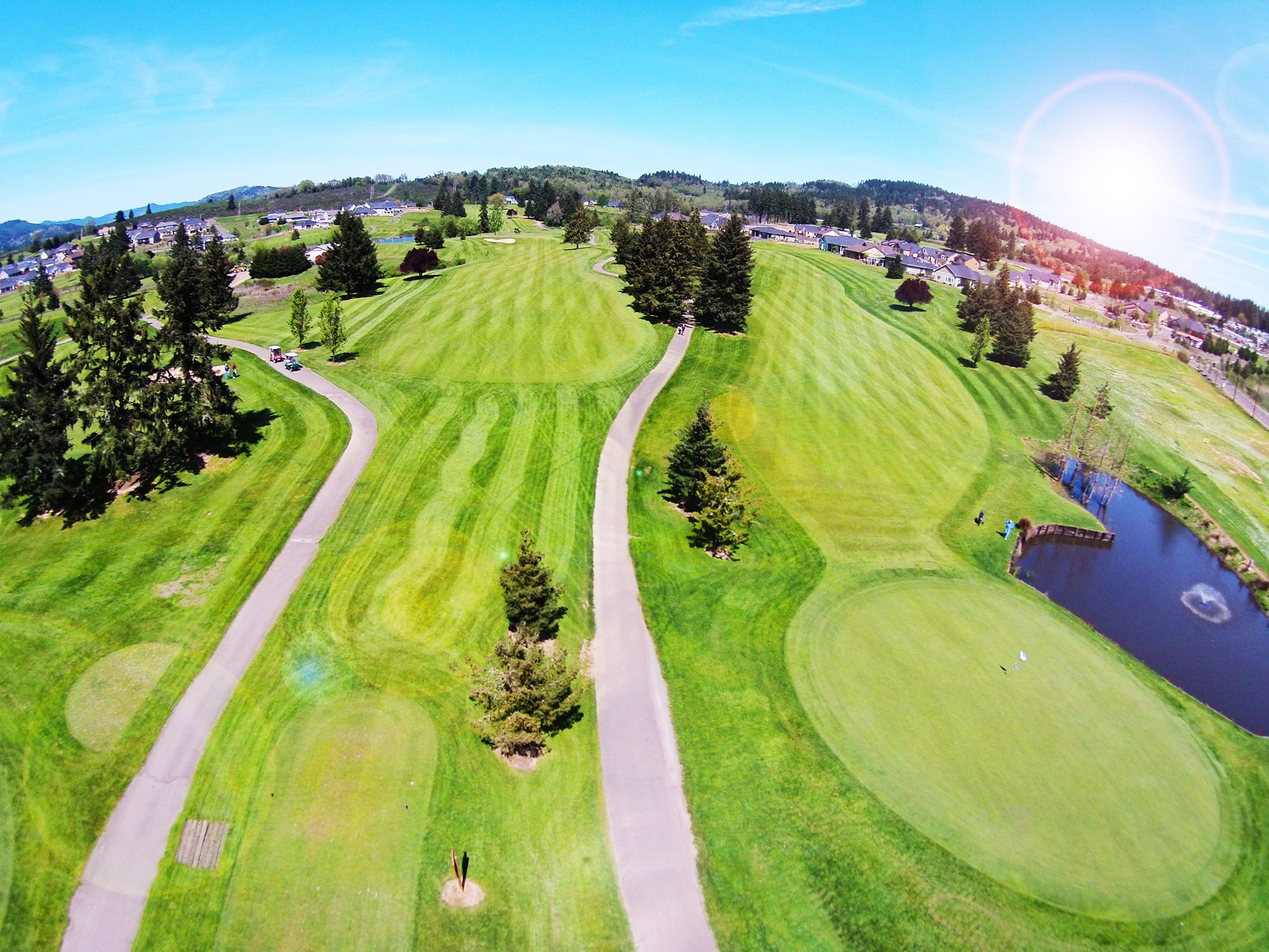 Golf course manicured green with paths